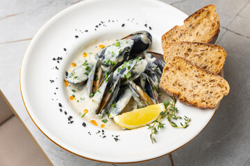 Cream of Mussel Soup on the table in the restaurant
