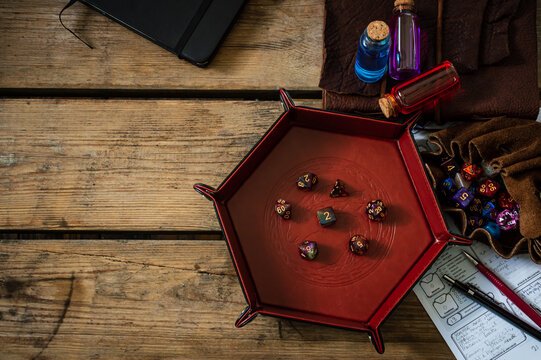 Overhead Image Of TTRPG Equipment On A Wooden Table