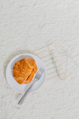 Morning breakfast with coffee and croissant. Still life concept.