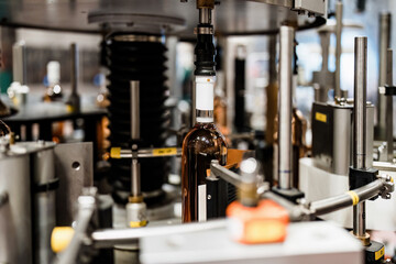 Industrial wine bottling plant theme. Modern industry production line for alcohol drink bottling and packaging.