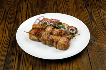 baked meat, barbecue on a wooden table
