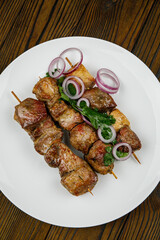 baked meat, barbecue on a wooden table
