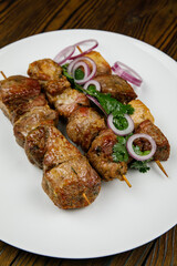 baked meat, barbecue on a wooden table
