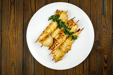 baked meat, barbecue on a wooden table
