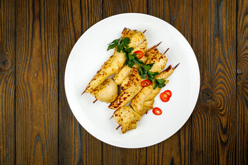 baked meat, barbecue on a wooden table
