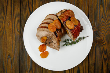 baked meat, pork on a wooden table
