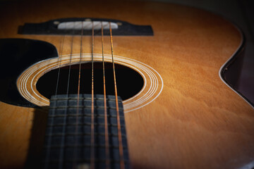 Close-up and details of old acoustic guitar, Line and curve of instrument, Selective focus of...