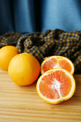close up of slice of orange fruit on wooden background 