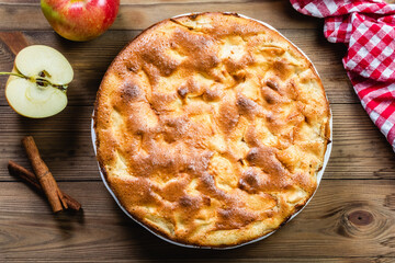 Apple pie on wooden background. Top view, copy space, flat lay.