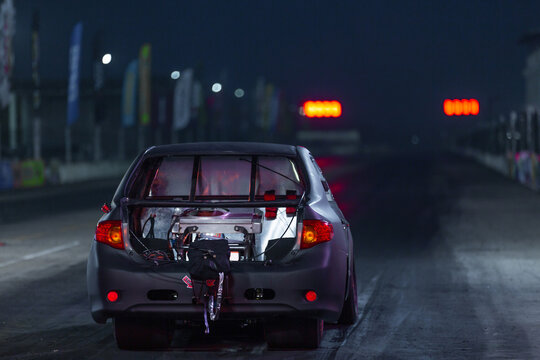 Drag Racing Car At The Start Competition At Night, Drag Race Car In Race Track At Night, Sport Car At The Start, Speed Competition, Drag Racing, High Speed.