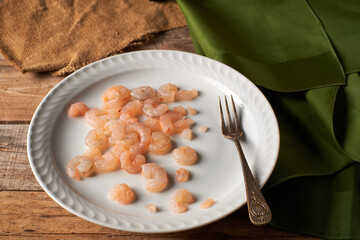 Small peeled prawns on a plate