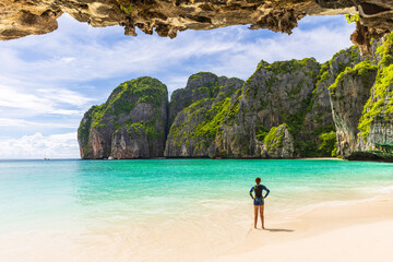 Young Asian lady tourist on the  the beach, Ma Ya bay, Phi Phi island  krabi province Thailand.