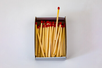 Wooden matches with red heads