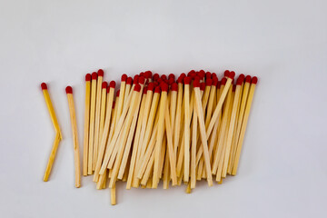 Wooden matches with red heads