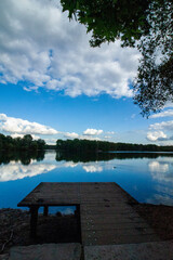 One of the lakes in Duisburg with view from a small dock across the lake into the woods