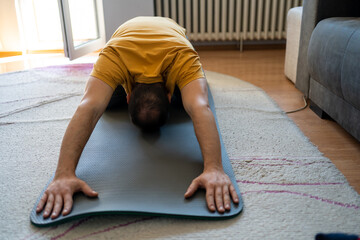 Man doing back stretch at home.