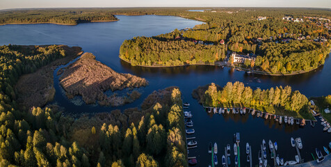 Top view of the Augustow Canal and Lake Necko on an autumn day at sunset.