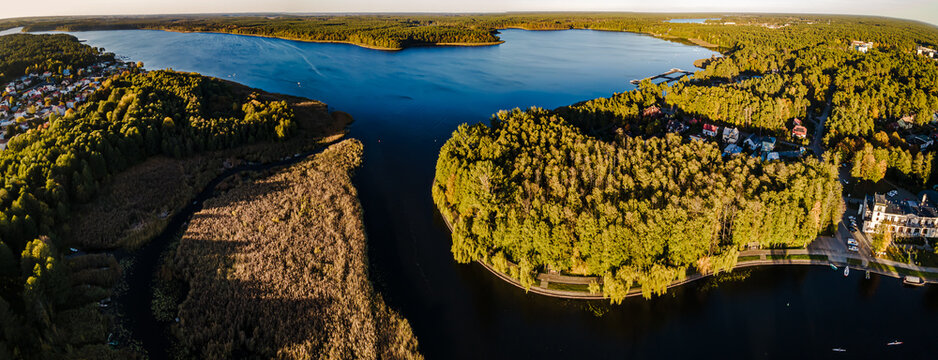Top view of the Augustow Canal and Lake Necko on an autumn day at sunset.