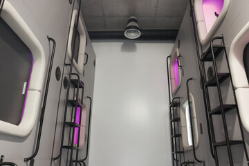 Capsules in modern pod hostel. Stylish interior