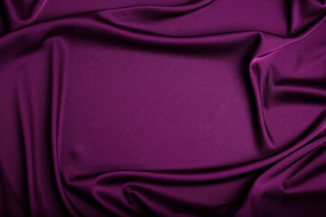 Crumpled purple silk fabric as background, top view. Space for text