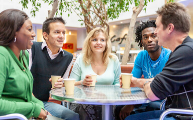 Adult Education: College Conversation. A group of mature students enjoying a break from their studies. From a series of related images on the subject.