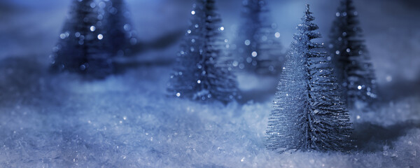 abstract glittering christmas tree decoration at snowy night, winter scene for merry christmas or happy new year greeting card with copy space