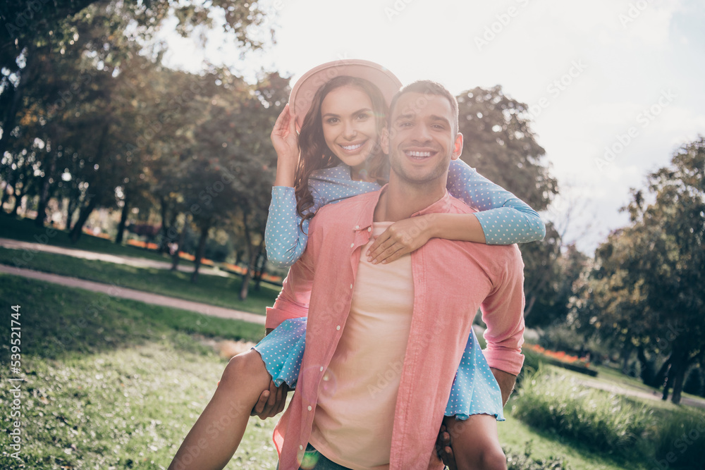 Canvas Prints Photo of two young lovely romance date together hug back smiling chill on nature park happy wear stylish clothes