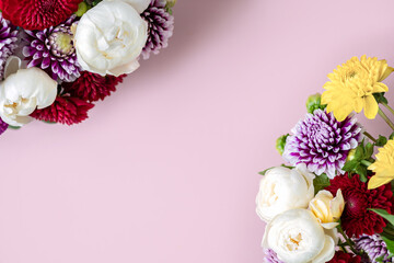 Beautiful bunch of dahlia flowers on pink background, Autumn garden flowers, copy space