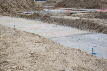 On site: Working at the basement - installation of underground infrastructure - different color...