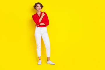 Fototapeta na wymiar Full body photo of positive charming lady direct finger empty space promotion isolated on yellow color background