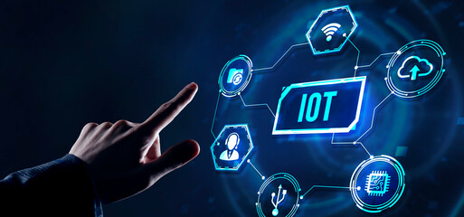 Internet of things - IOT concept. Businessman offer IOT products and solutions. Internet, business, Technology and network concept. Virtual button.