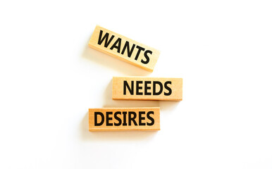 Wants needs and desires symbol. Concept words Wants Needs Desires on wooden blocks. Beautiful white...