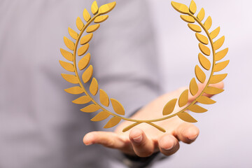 winner honer prize in hand