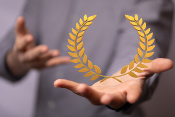 winner honer prize in hand