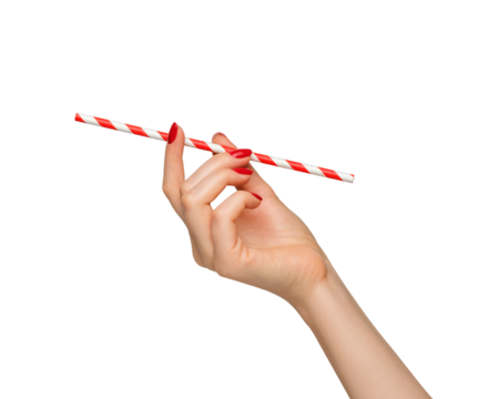 A bright straw for drinks in a woman's hand with red nail polish.