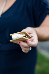 Woman's Hand Holding Smore Sandwich Closeup