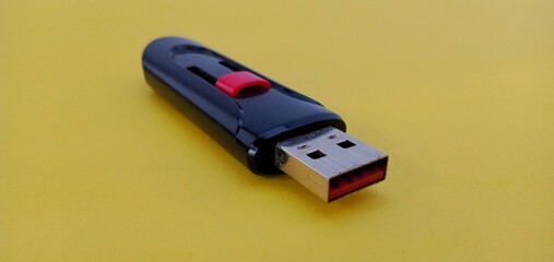 Modern USB Flash drive on yellow background