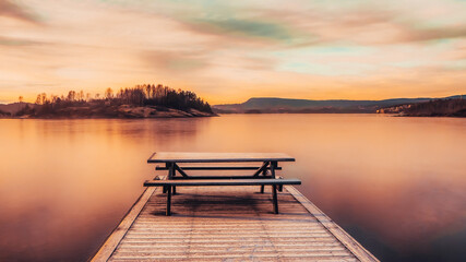 Naklejka na ściany i meble Beautiful sunrise over the lake in the evening time