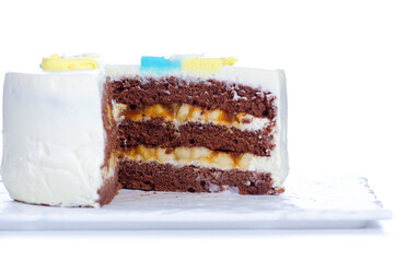 Chocolate сake in a section with bananas on white background isolation