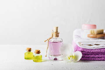 Obraz na płótnie Canvas Essential oils, perfumed water in glass bottles.