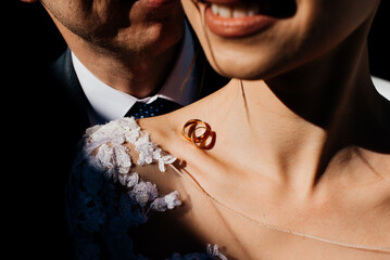 wedding rings on the bride's collarbone