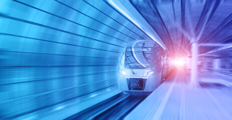Modern train on in the illuminated tunnel rushes at high speed with motion blur. Format banner header size, place for text.