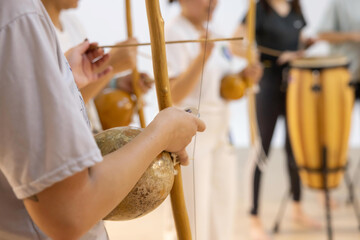 Capoeirsta Playing Berimbau in a Capoeira Roda