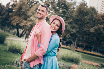 Photo of pretty charming young wife husband dressed summer clothes embracing smiling outdoors backyard