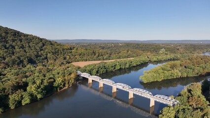 Natural landscape with Potomac river in beautiful early morning sunlight at Point of Rocks Maryland, Virginia border bridge crossing