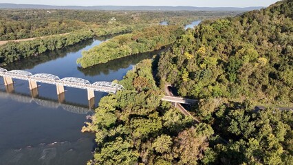 Natural landscape with Potomac river in beautiful early morning sunlight at Point of Rocks Maryland, Virginia border bridge crossing