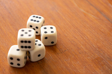 Numbered plastic pieces on a table. Board game called dice.
