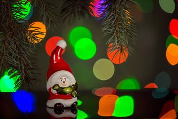 Happy snowman toy sparkling and fabulous bokeh background with copy space. Christmas background for postcards. Christmas decoration concept.