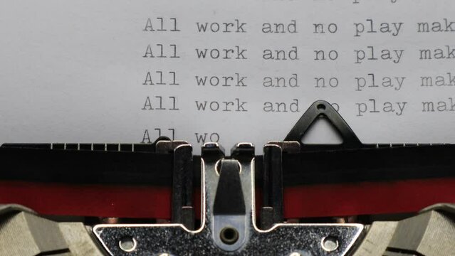 Typing ALL WORK AND NO PLAY MAKES JACK A DULL BOY with an old vintage Typewriter