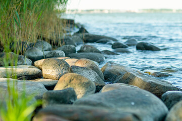 Obraz na płótnie Canvas rocky shore of the lake, close up